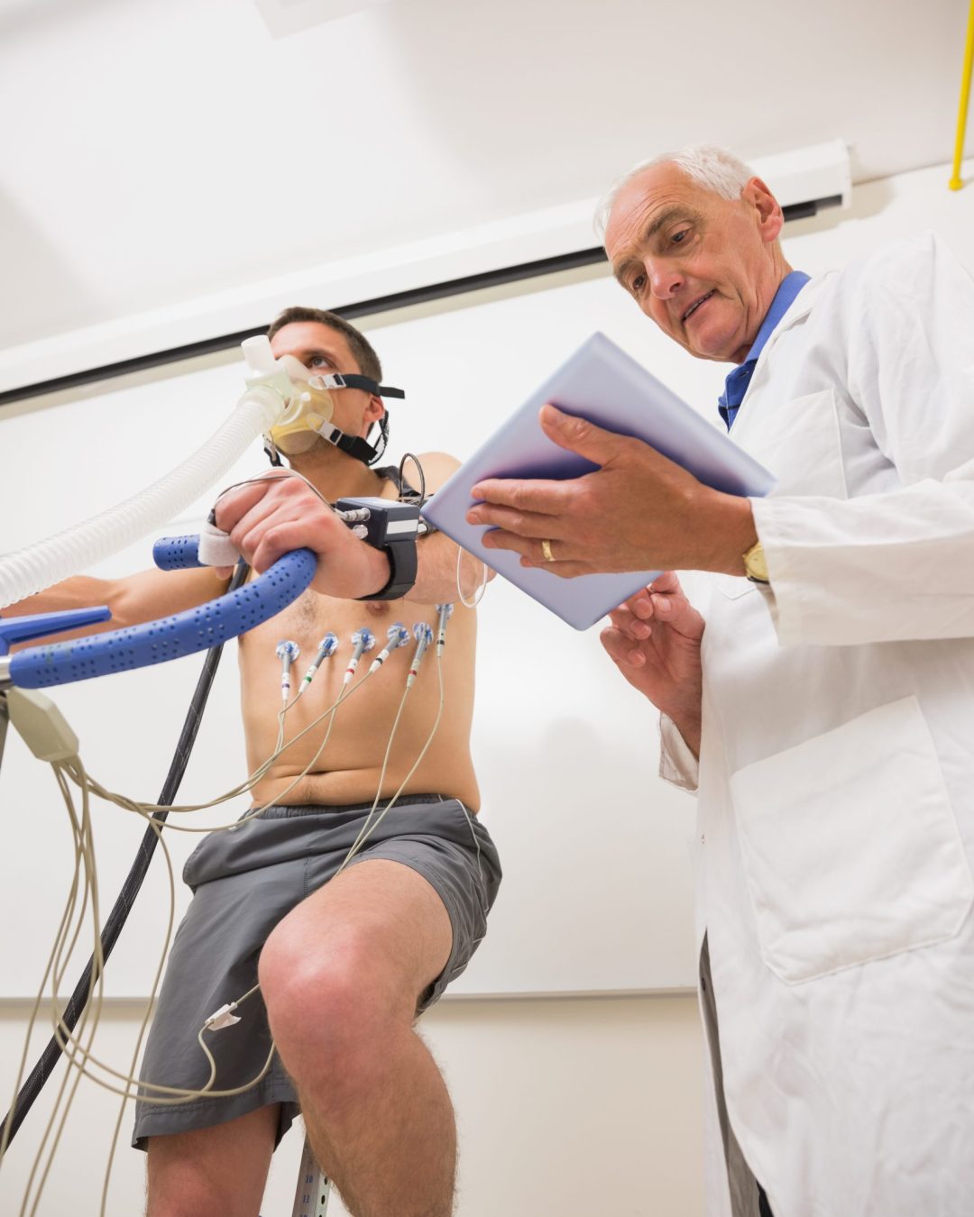 Man doing fitness test on exercise bike at the medical centre